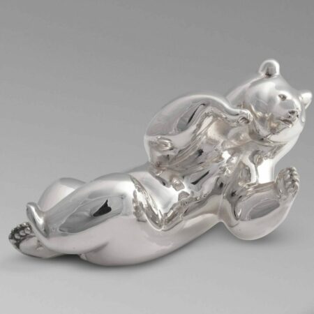 Picture of a silver sculpture representing a bear made by artist Michel Bassompierre, currently on show at Galerie Montmartre, Paris, France